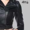 Close-up of zipper and leather texture on woman short black leather jacket