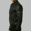 Side profile of black leather bomber jacket showing fitted cut and zip pocket