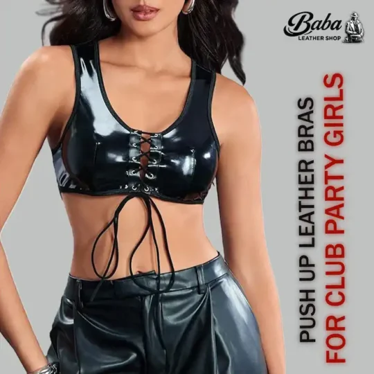 Model wearing a glossy black leather lace up top with front cross-lacing