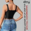 Back view of leather zip-up crop top showing strap adjustment