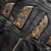 Close-up of genuine leather texture and stitching on vintage jacket