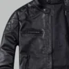 Black leather jacket with quilted shoulder detail and zip pockets