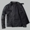 Black leather jacket with quilted shoulder details and zip pockets