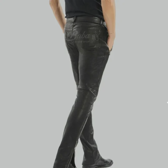Mens black leather pants back view with patch pocket and ankle zippers, slim fit