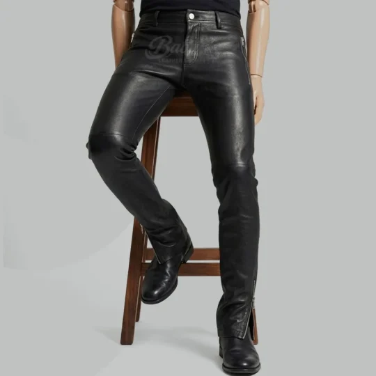 Mens black leather pants front view with zip pockets and ankle zippers, slim fit